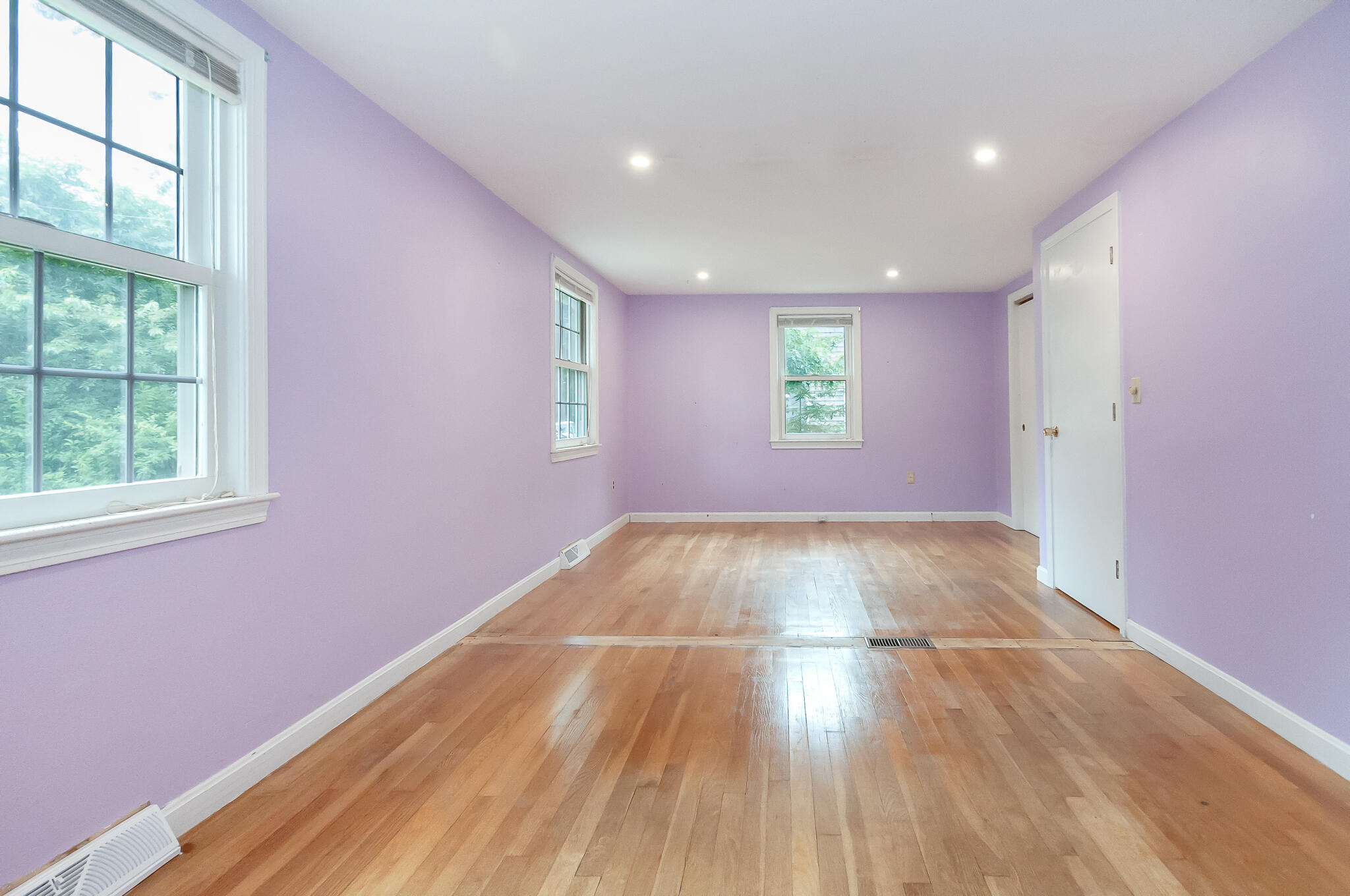 64 Taft Road West Yarmouth, MA 02673 - Photo 11 of 21 an empty room with wooden floor and windows