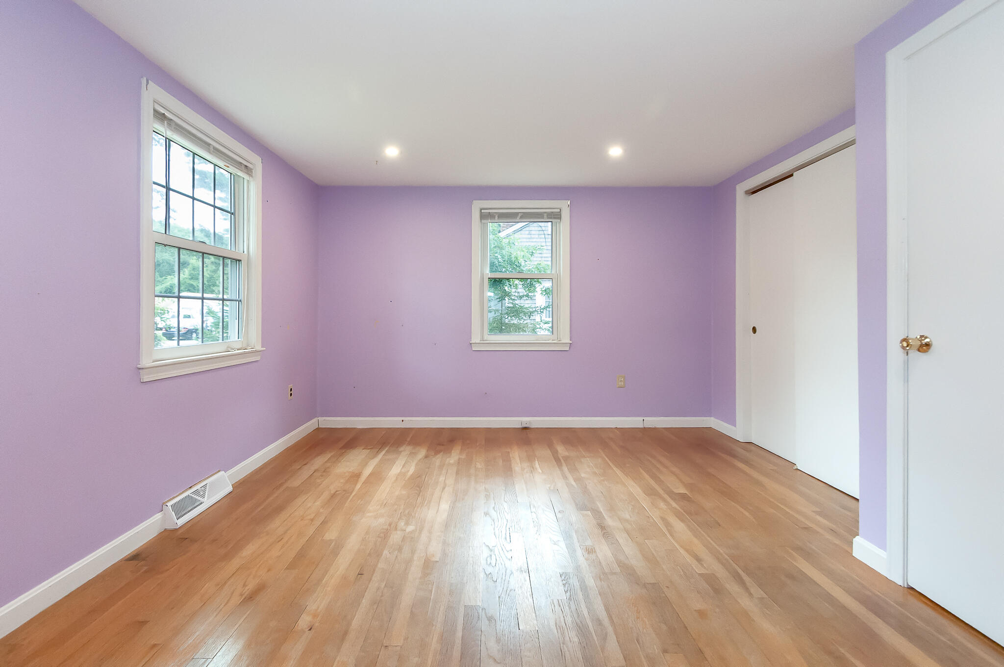 64 Taft Road West Yarmouth, MA 02673 - Photo 12 of 21 an empty room with wooden floor and windows