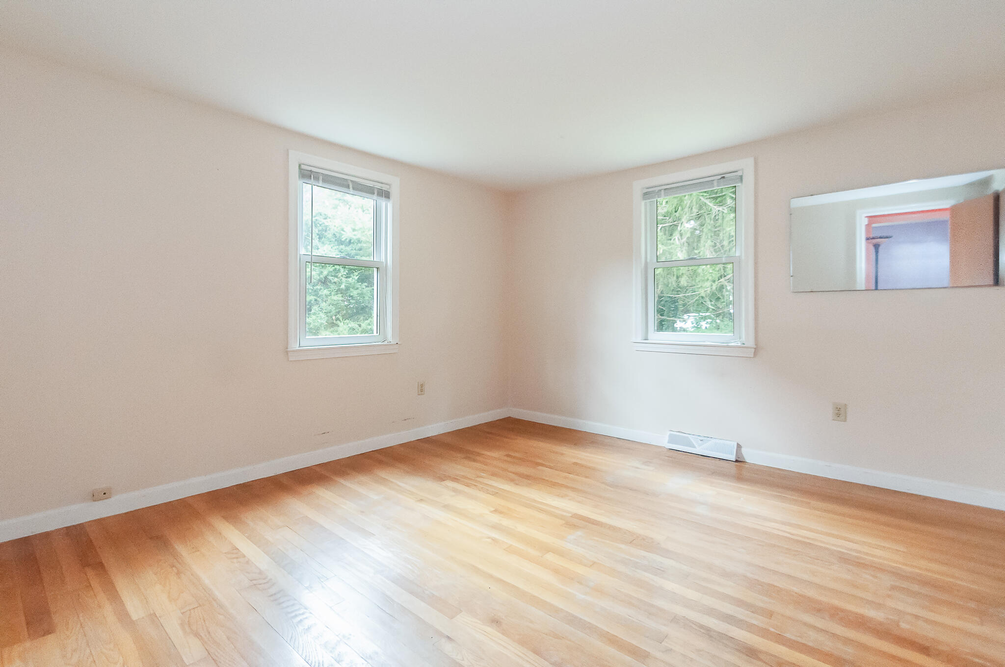 64 Taft Road West Yarmouth, MA 02673 - Photo 14 of 21 an empty room with wooden floor and windows
