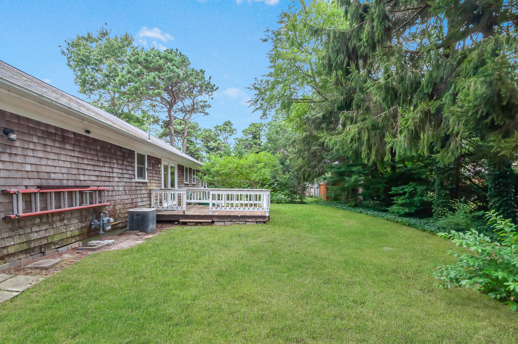 64 Taft Road West Yarmouth, MA 02673 - Photo 17 of 21 a view of a house with a yard and sitting area