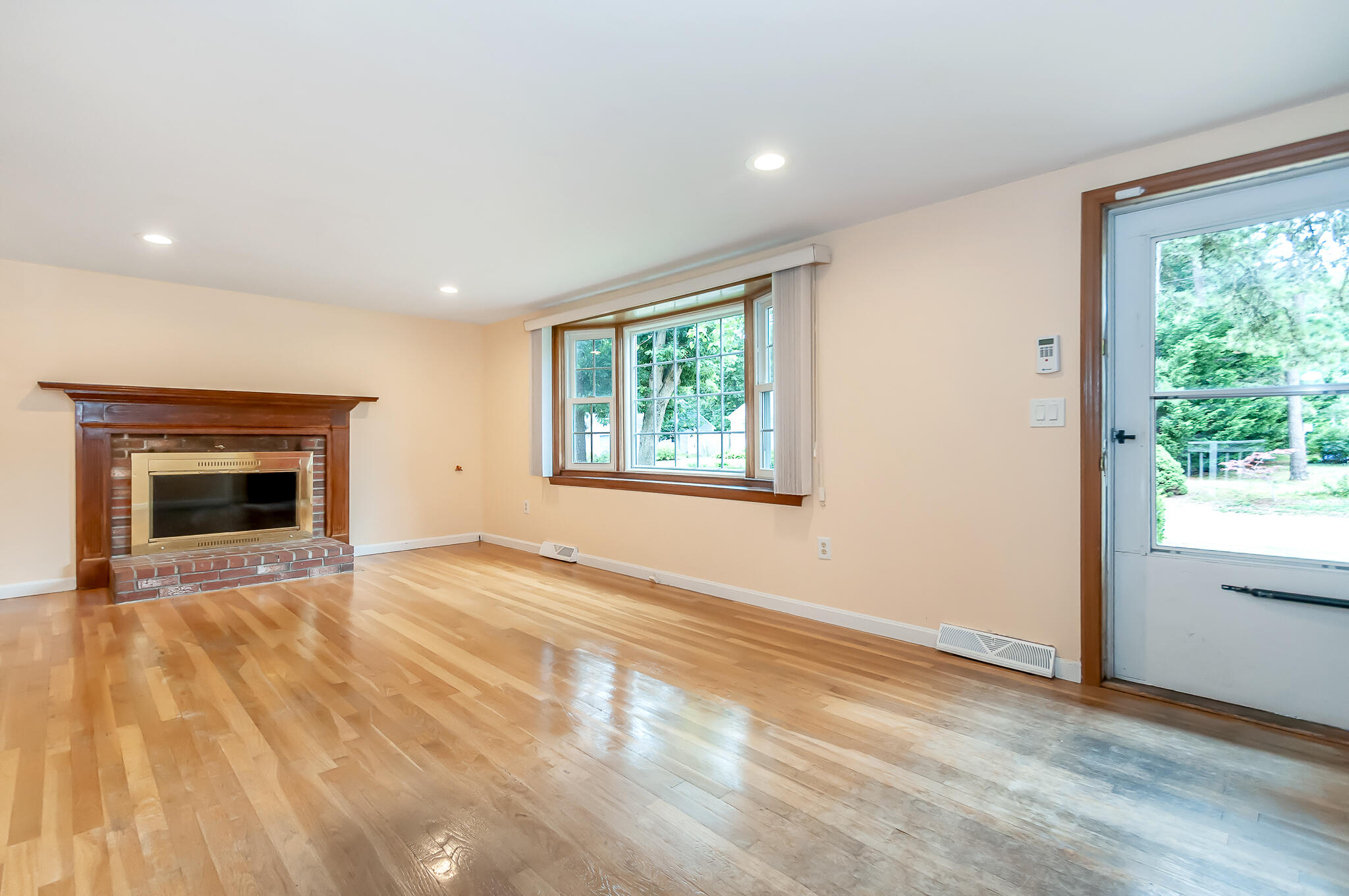 64 Taft Road West Yarmouth, MA 02673 - Photo 3 of 21 a view of empty room with window and fireplace
