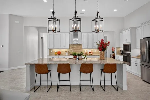 a living room with furniture fireplace and a chandelier