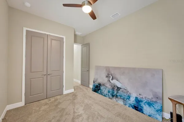 a yellow house with trees in front of it