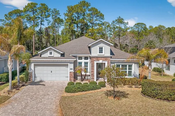 an aerial view of a houses with outdoor space