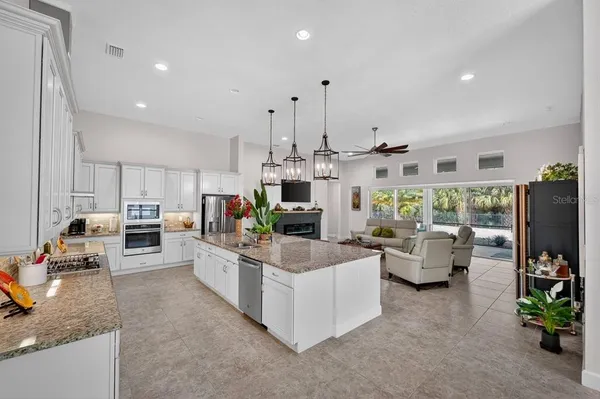 a living room with fireplace furniture and a flat screen tv