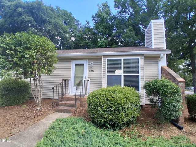 a house view with a garden space