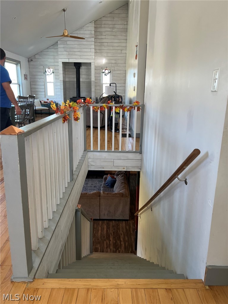15393 Shade Road Guysville, OH 45735 - Photo 14 of 35 Multi-level interior featuring light wood-finish flooring, white painted walls, and a staircase with painted balusters and handrails