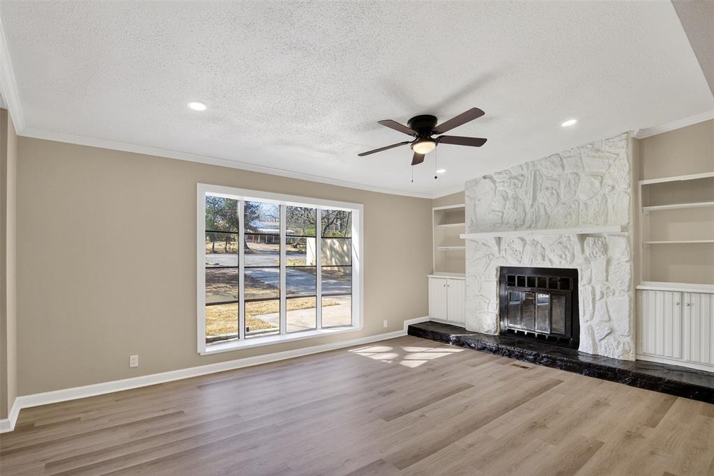 6949 Klug Pines Road Shreveport, LA 71129 - Photo 4 of 18 Living Room with Wood Burning Fireplace