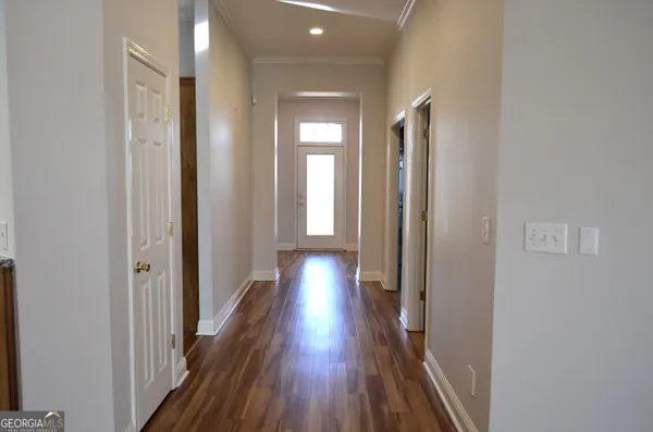 a view of gallery with wooden floor