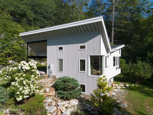 a view of a house with a small yard