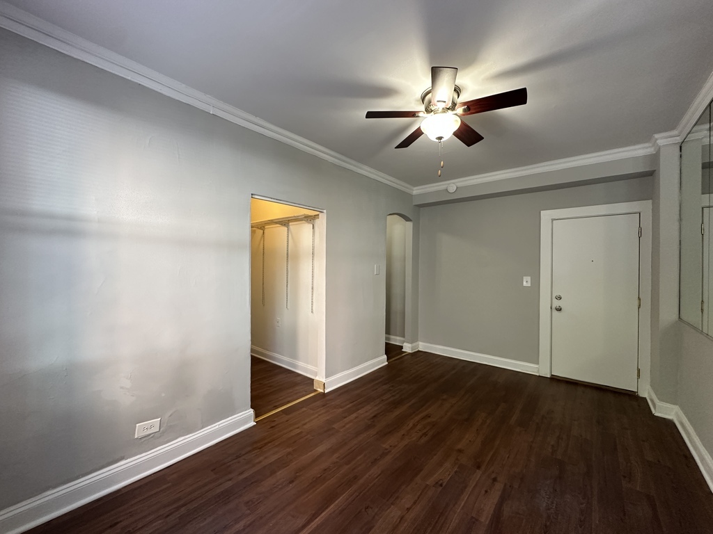 661 West Sheridan Road, Unit 208 Chicago, IL 60613 - Photo 11 of 20 a view of empty room with wooden floor