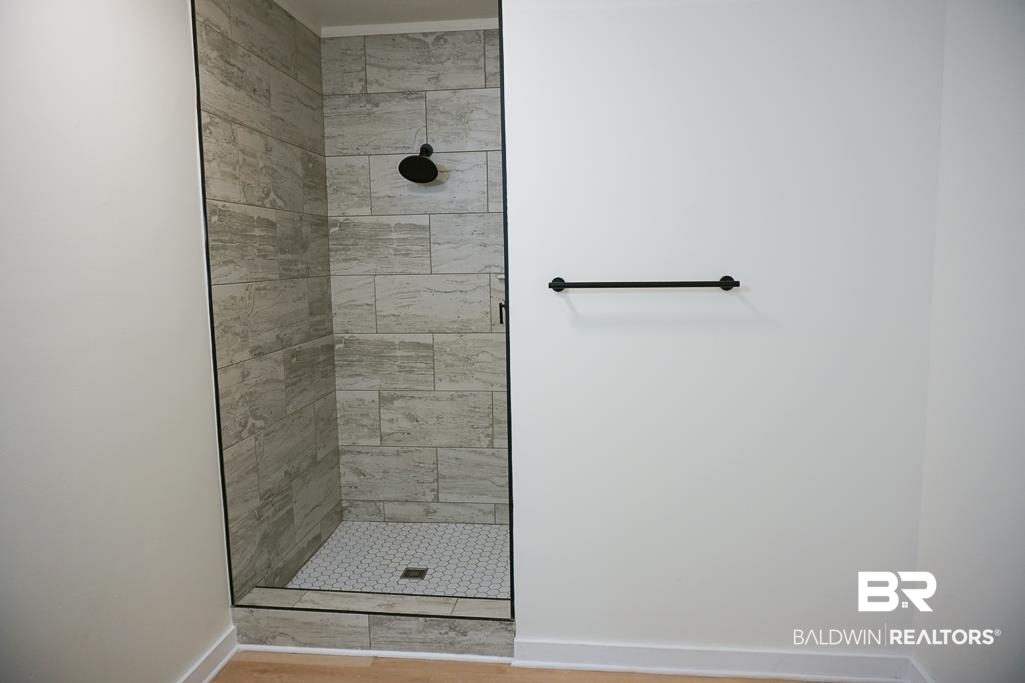 4667 Cottonwood Drive Mobile, AL 36608 - Photo 15 of 21 Bathroom with hardwood / wood-style floors and tiled shower