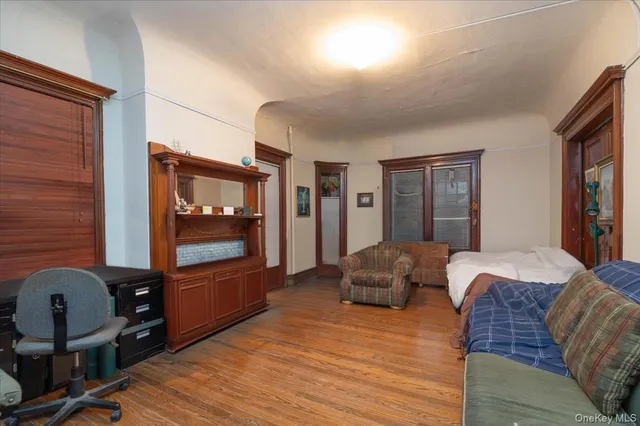 a bedroom with furniture and a window