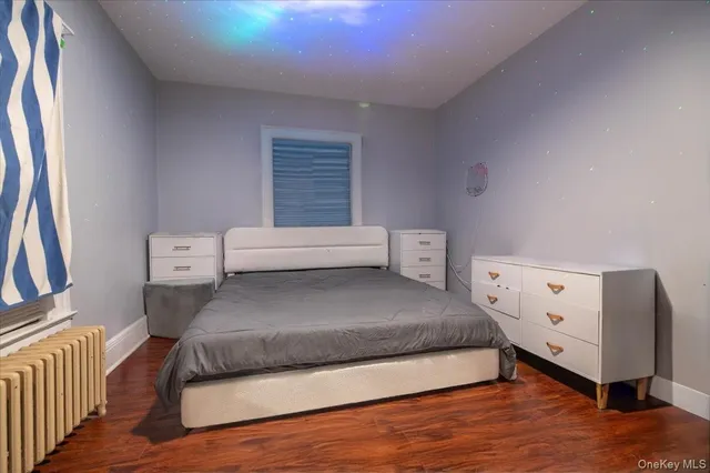 a living room with a bed and a window