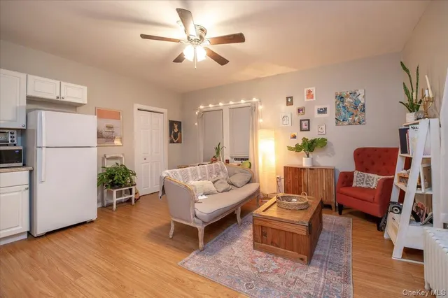 a bedroom with furniture and a wooden floor