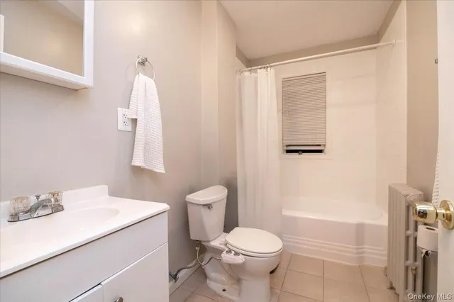 a bed room with a bed window and a chair