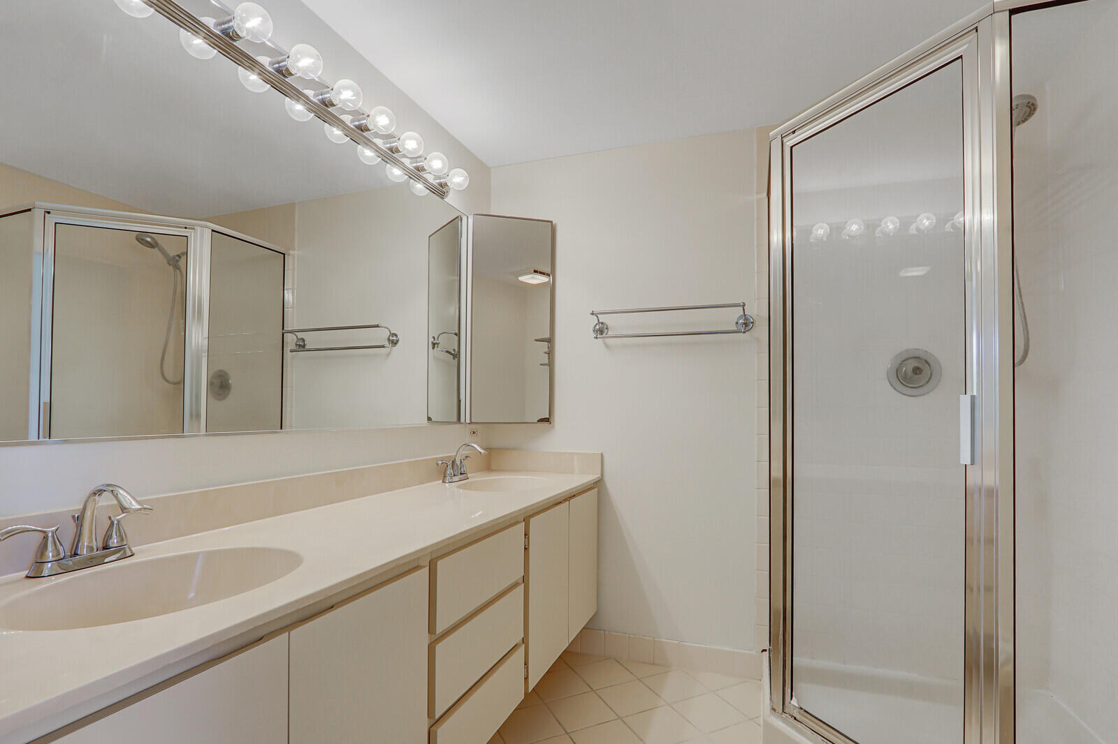 3026 30th Court Jupiter, FL 33477 - Photo 11 of 15 a bathroom with a double vanity sink mirror and double