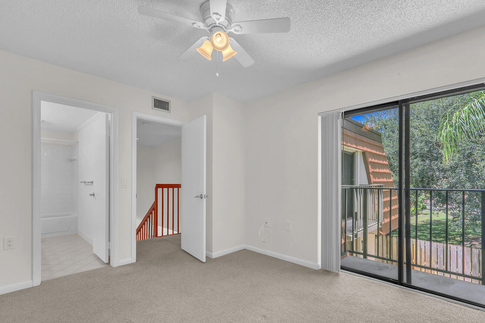 3026 30th Court Jupiter, FL 33477 - Photo 13 of 15 wooden floor in an empty room with a window