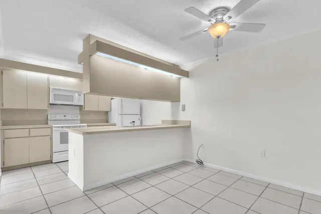 a kitchen with stainless steel appliances a sink and cabinets