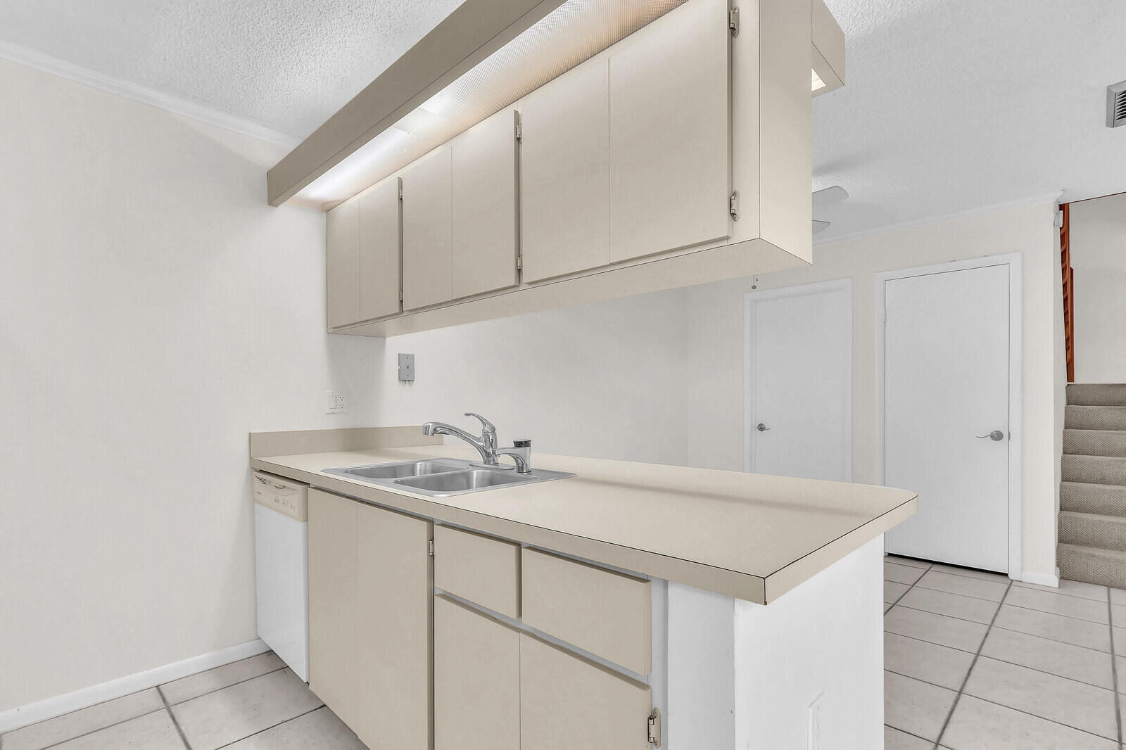 3026 30th Court Jupiter, FL 33477 - Photo 6 of 15 a bathroom with a sink and cabinets