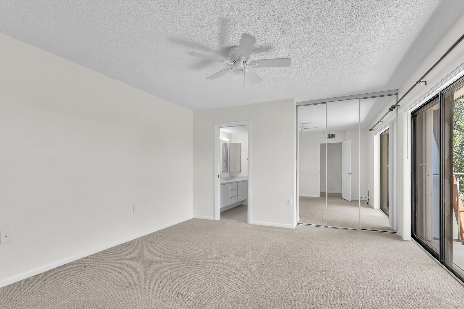 3026 30th Court Jupiter, FL 33477 - Photo 8 of 15 a view of a big room with closet and windows