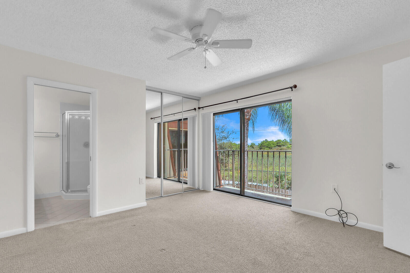 3026 30th Court Jupiter, FL 33477 - Photo 9 of 15 a view of a livingroom with a ceiling fan and window