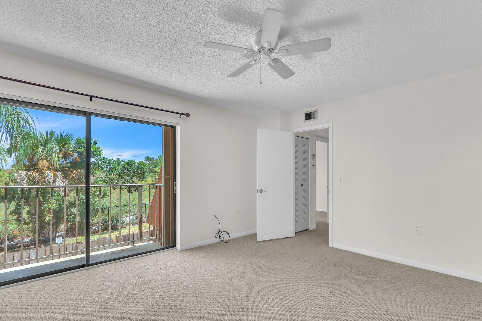 3026 30th Court Jupiter, FL 33477 - Photo 10 of 15 a view of room with window and ceiling fan