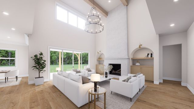 a living room with furniture a fireplace and a large window