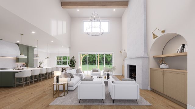 a living room with furniture chandelier and a fireplace