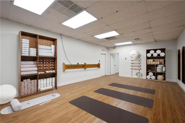 a view of a bedroom with furniture and window
