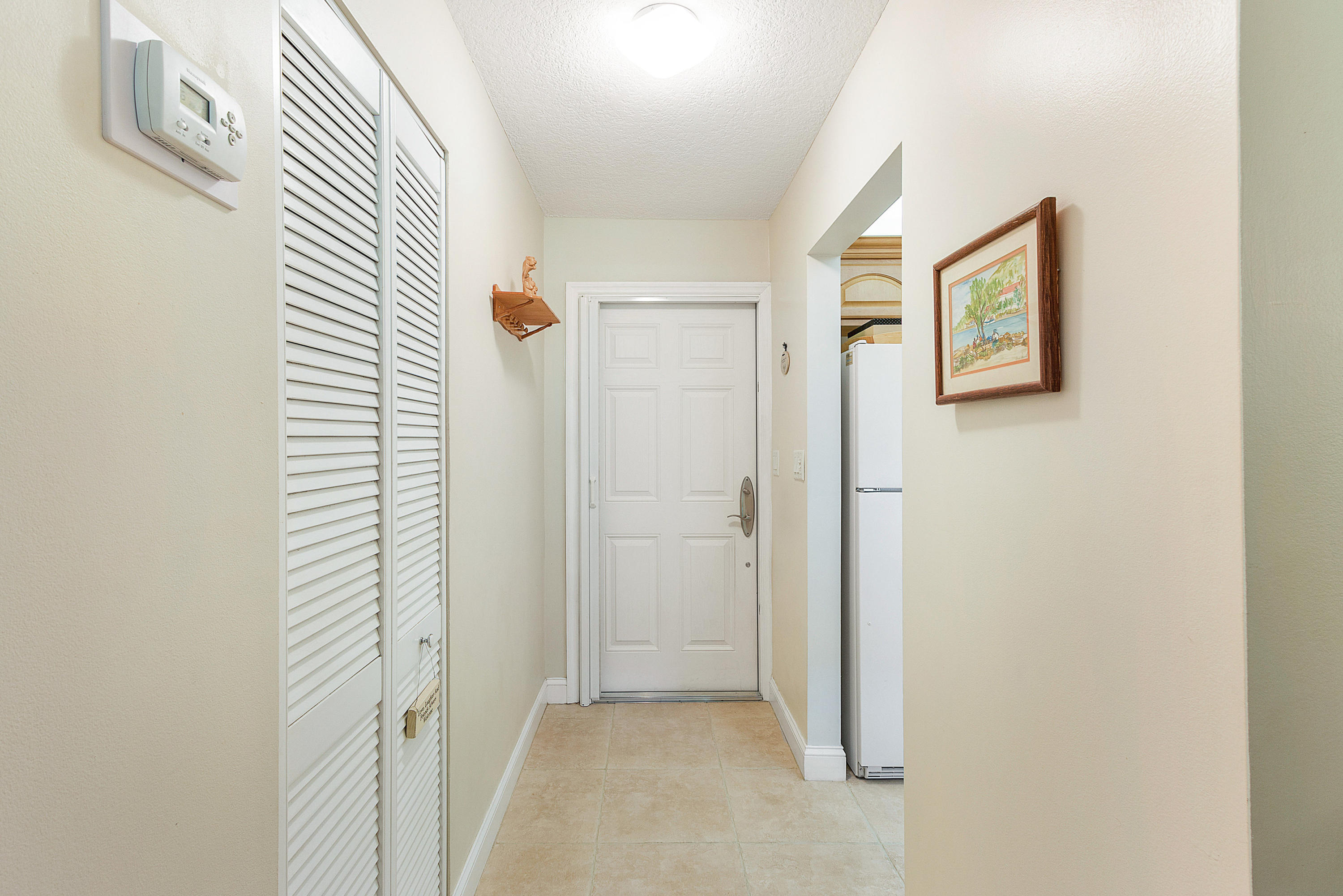 6905 Tiburon Circle, Unit 101 Boca Raton, FL 33433 - Photo 3 of 23 Foyer