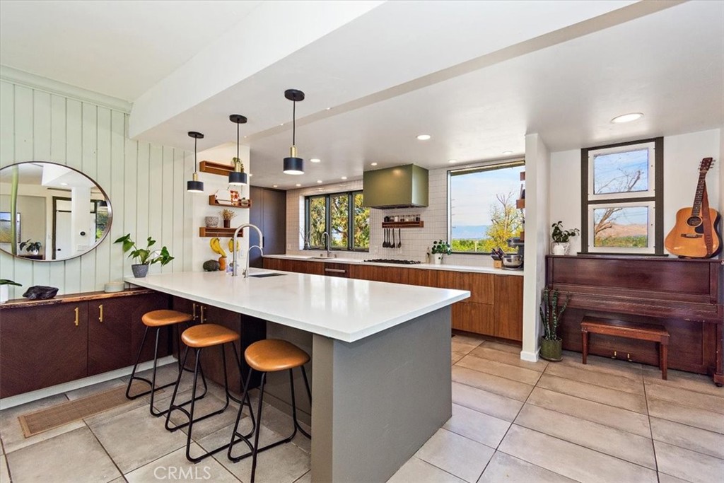 3052 Panorama Road Riverside, CA 92506 - Photo 18 of 53 a large kitchen with stainless steel appliances a stove and a refrigerator