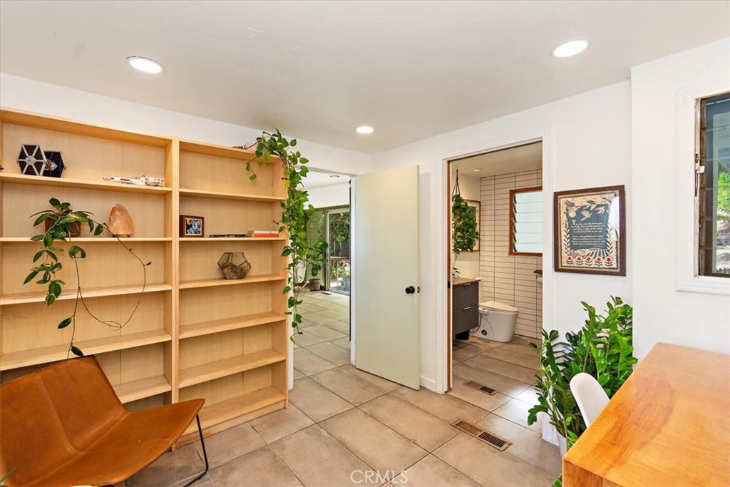 3052 Panorama Road Riverside, CA 92506 - Photo 22 of 53 a view of a room with shelves
