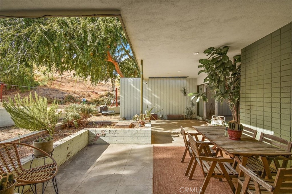 3052 Panorama Road Riverside, CA 92506 - Photo 42 of 53 a view of a swimming pool with outdoor seating and plants