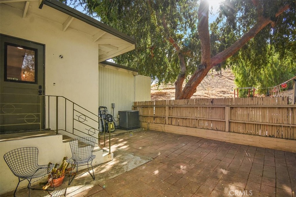 3052 Panorama Road Riverside, CA 92506 - Photo 50 of 53 a view of a porch with wooden fence and a bench