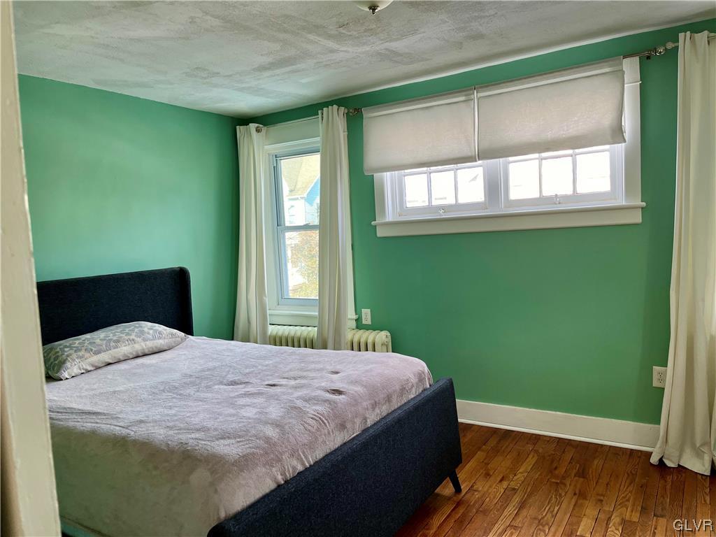 715 Spring Street Bethlehem, PA 18018 - Photo 12 of 28 a bedroom with a bed and a window