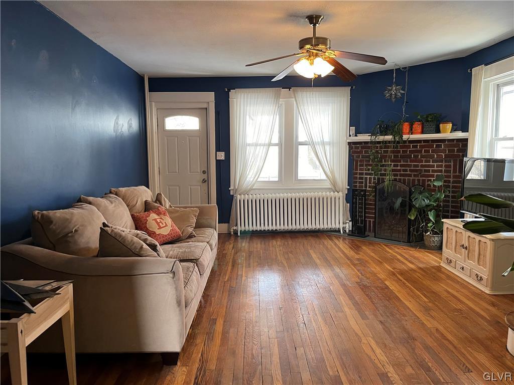 715 Spring Street Bethlehem, PA 18018 - Photo 3 of 28 a living room with furniture and a fireplace