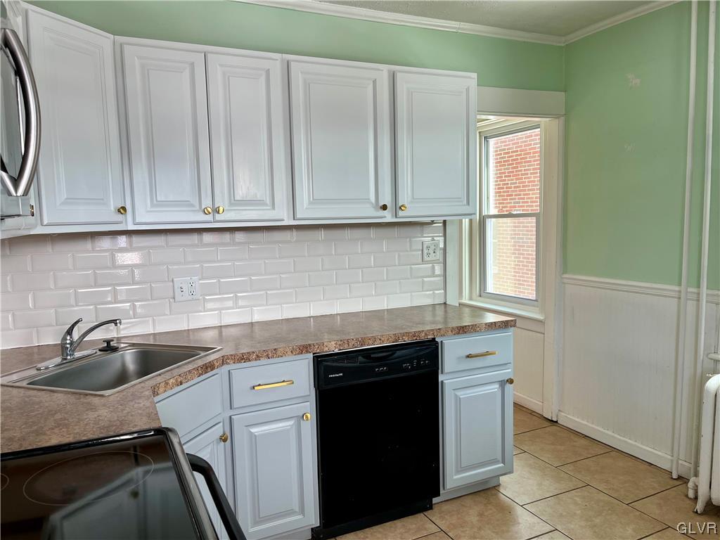 715 Spring Street Bethlehem, PA 18018 - Photo 6 of 28 a kitchen with granite countertop a sink and a stove