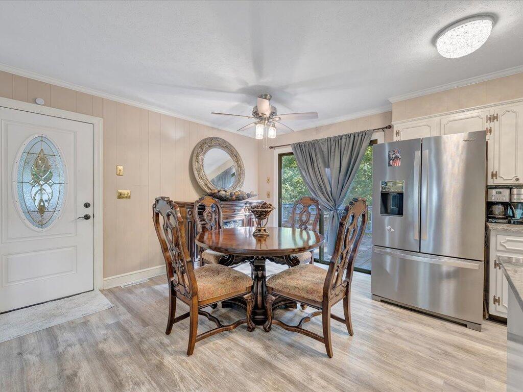 525 Mulberry Road Ridgeway, VA 24148 - Photo 11 of 55 a view of a dining room with furniture window and wooden floor