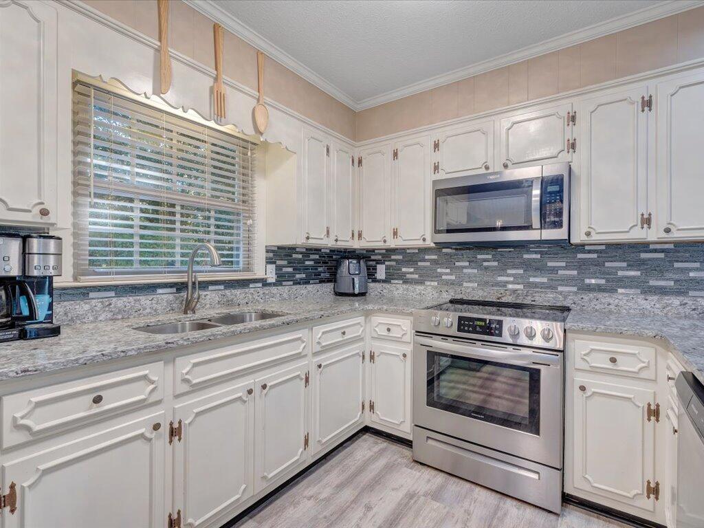 525 Mulberry Road Ridgeway, VA 24148 - Photo 18 of 55 a kitchen with appliances cabinets and a sink