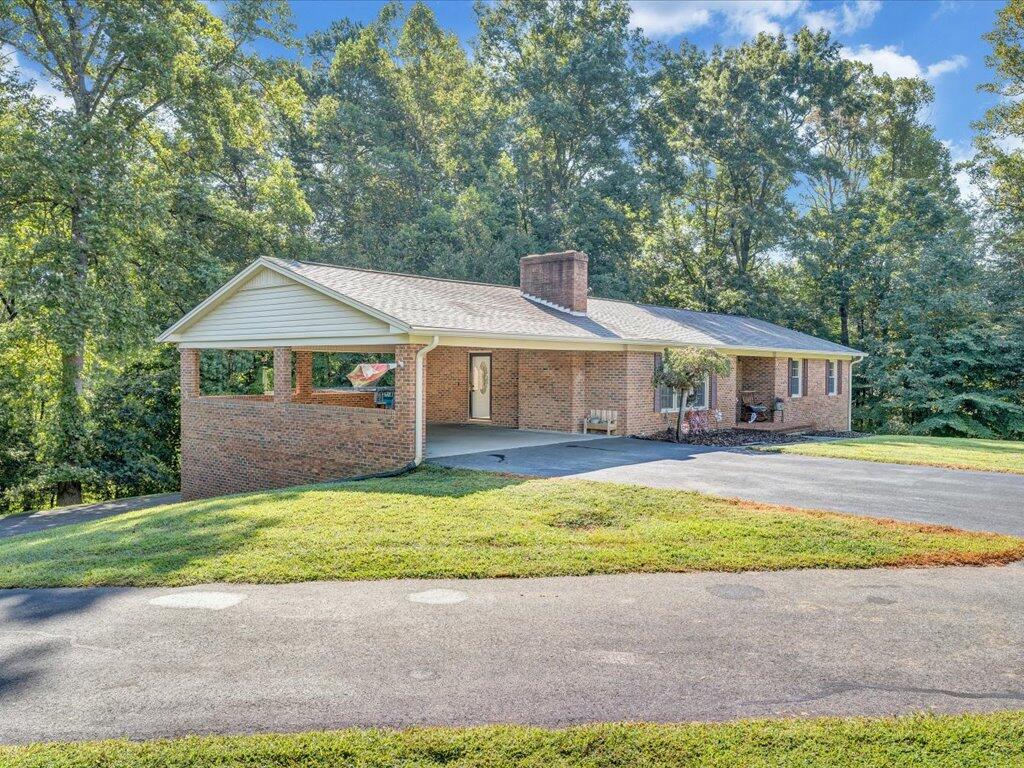 525 Mulberry Road Ridgeway, VA 24148 - Photo 2 of 55 a front view of a house with a yard and porch