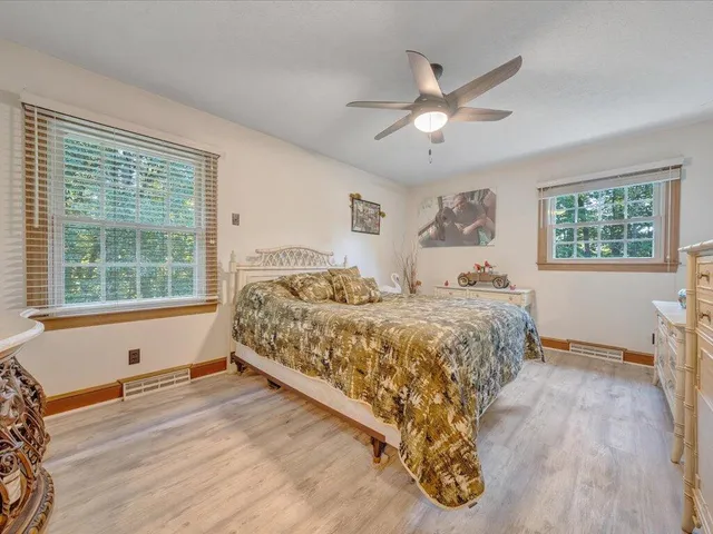 a bed room with a bed and a window