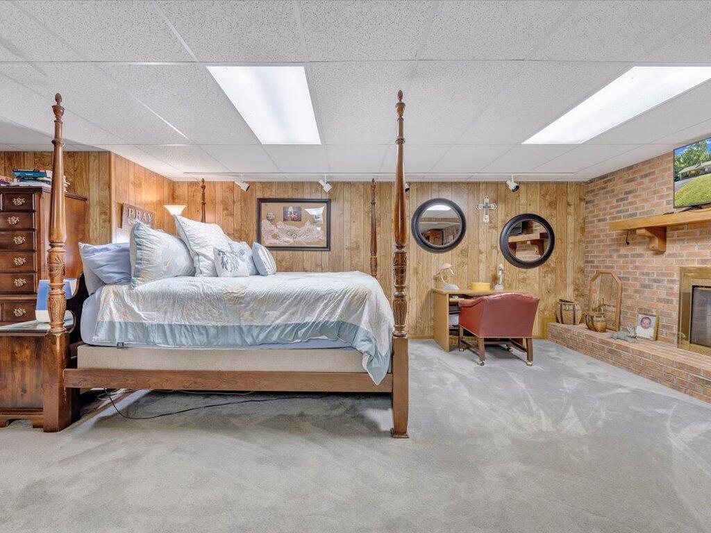 525 Mulberry Road Ridgeway, VA 24148 - Photo 34 of 55 a bedroom with bed and a chandelier