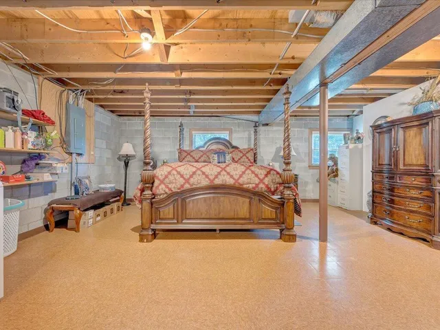 a balcony with wooden floor table and chairs