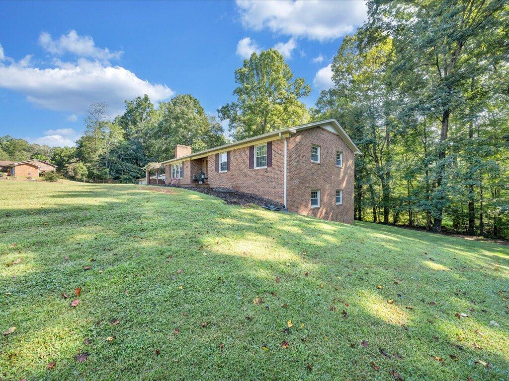 525 Mulberry Road Ridgeway, VA 24148 - Photo 46 of 55 a front view of a house with garden