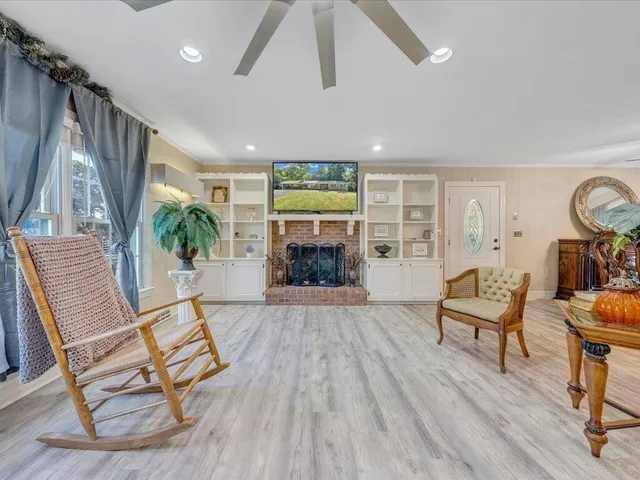 a dining room with furniture garden view and a chandelier