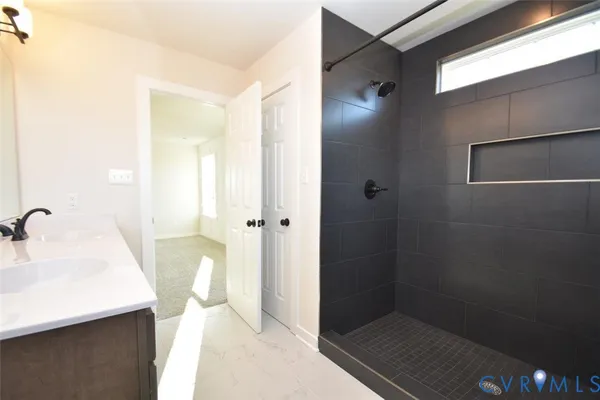 a bathroom with a sink and mirror