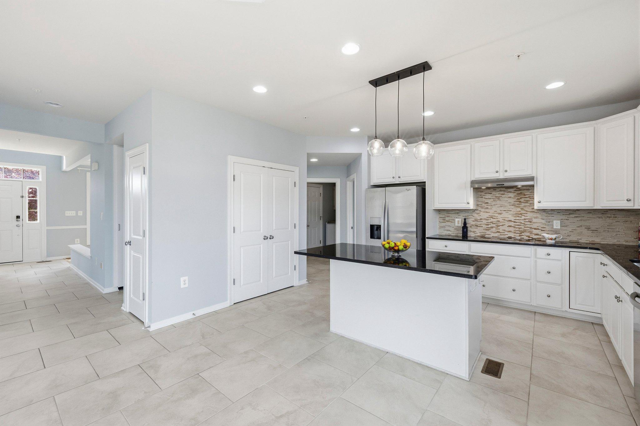1105 Verbena Court Silver Spring, MD 20906 - Photo 10 of 78 Kitchen with pantry and hallway to front foyer.