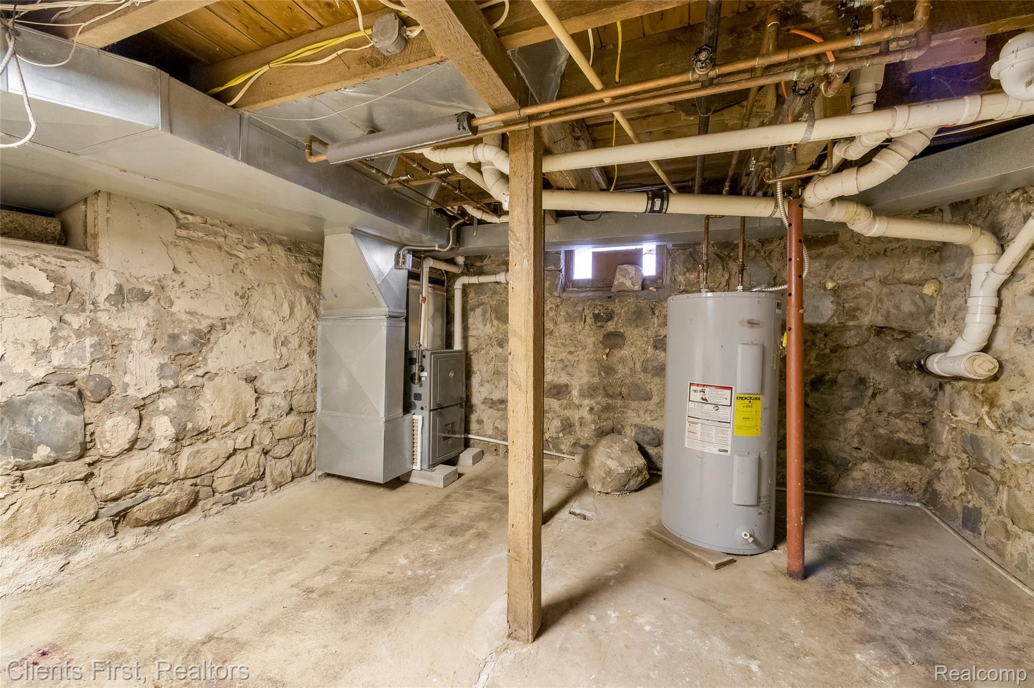 9985 Ford Road Ypsilanti, MI 48198 - Photo 44 of 58 Unfinished below grade area featuring water heater and heating unit