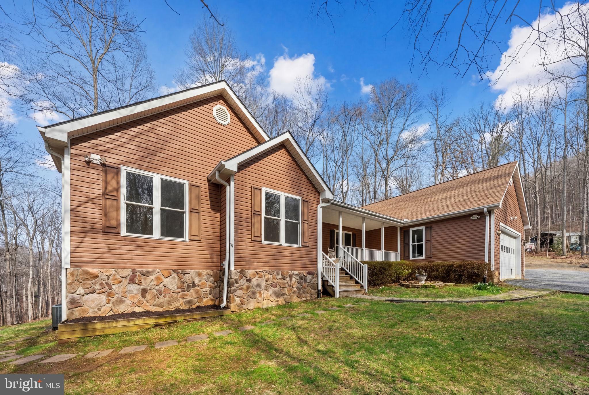 584 South Poes Road Amissville, VA 20106 - Photo 13 of 82 a front view of a house with a yard